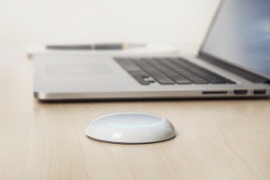 Photo of the Saent device on a desk.